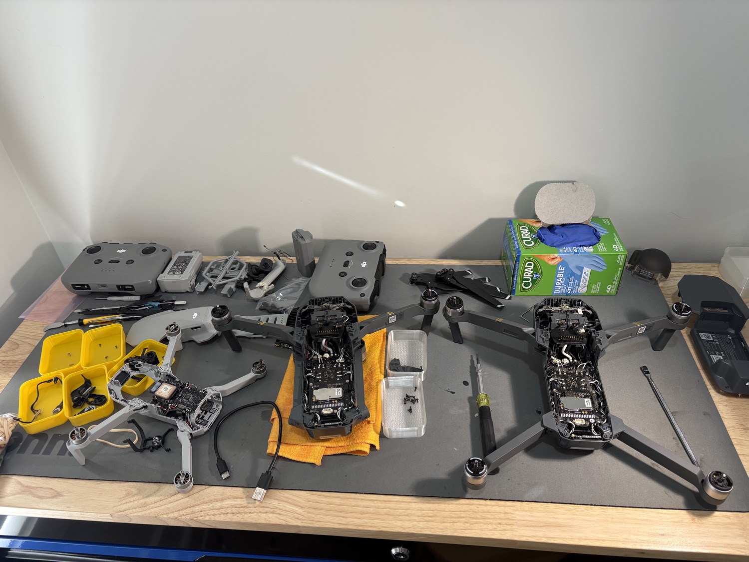 Drone repair workbench with drones being serviced